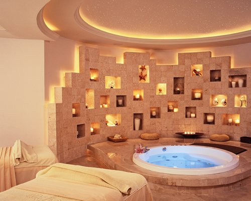 An indoor spa area with hot tub.