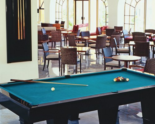 A large indoor recreation room with pool table.