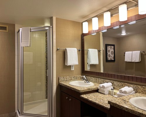 A well furnished bedroom with a bathtub.