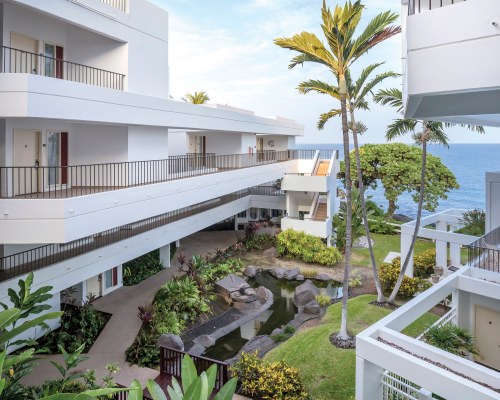AN EXTERIOR VIEW OF THE RESORT ALONGSIDE THE OCEAN.