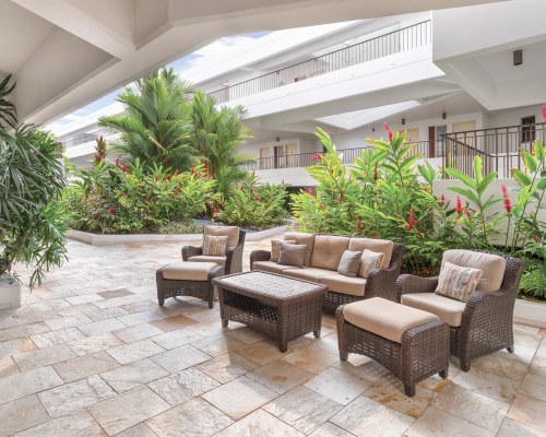 AN OUTDOOR LOUNGE AREA.