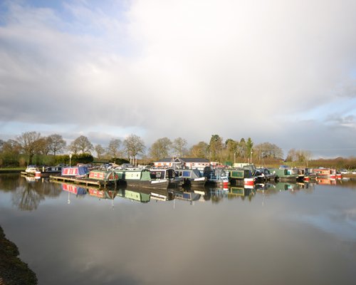 A view of canal boats in the water.