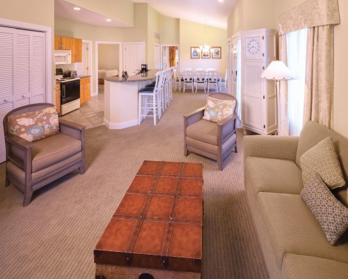 AN OPEN FLOOR PLAN INTERIOR LIVING DINING AND KITCHEN AREA.