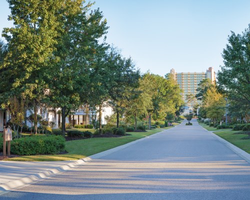 A VIEW OF LANDSCAPED EXTERIORS DOWN RESORT STREET.