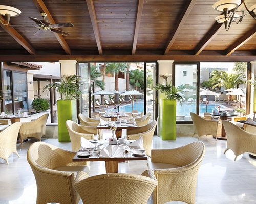An indoor hot tub and swimming pool with chaise lounge chairs at the resort.