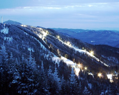 View of the mountain covered in snow at night.
