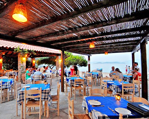 An outdoor fine dining restaurant alongside the waterfront.
