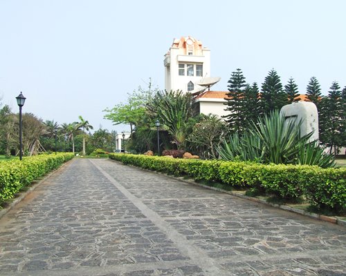 A scenic pathway leading to the Noble Yacht Club  Hainan resort.
