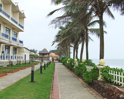 Scenic pathway alongside the resort with trees.