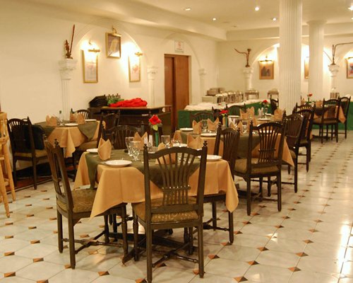 An indoor fine dining restaurant with multiple dining tables.
