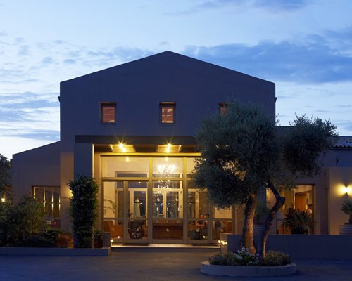 An exterior view of the resort unit at dusk.