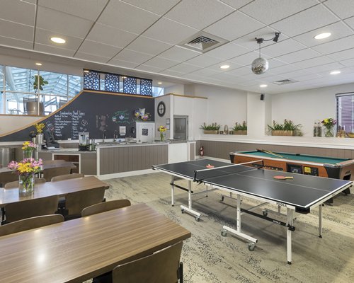 An indoor recreation room with pool table.