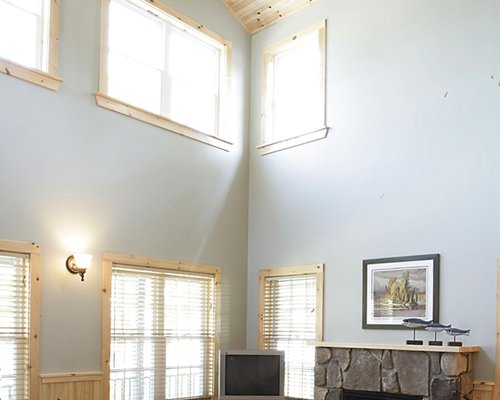 Furnished living room with television and fireplace.