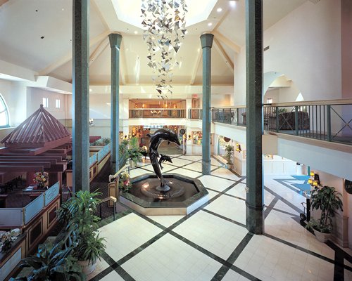Reception with restaurant and indoor balcony at The Delta Grand Okanagan Resort.