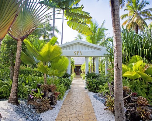 A paved pathway leading to the resort unit.