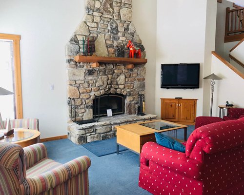 A well furnished living room with pull out sofas and an outside view.
