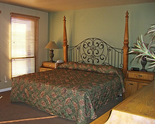 A well furnished bedroom with an outside view.