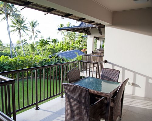 A balcony with patio furniture.