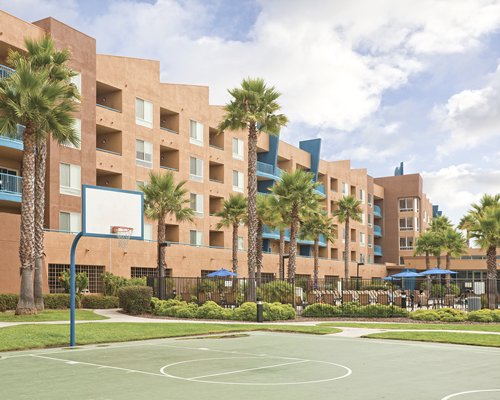 Exterior view of WorldMark Oceanside with a basketball court.
