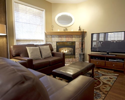 A well furnished living room with a fireplace.