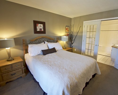 A well furnished bedroom with shower and bathtub.