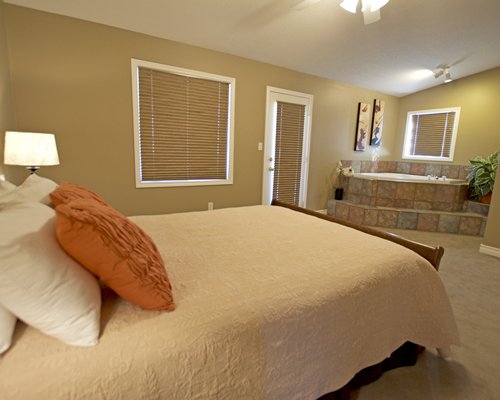 A well furnished bedroom with shower and bathtub.