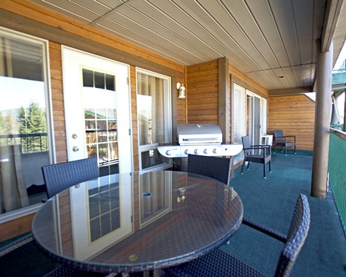 Balcony with patio and barbecue grill.