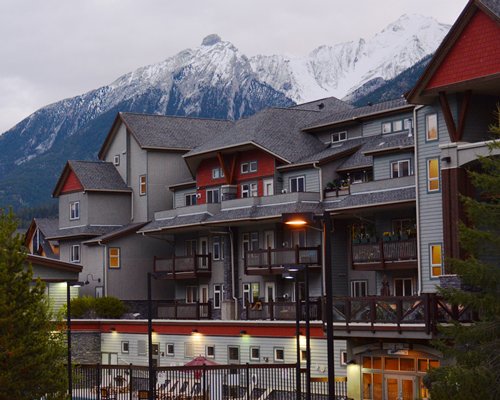 Scenic exterior view of Elkhorn at the Lodges with multiple balconies alongside the mountains during winter.