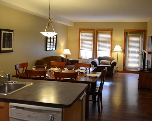 An open plan living room with a dining and kitchen area.