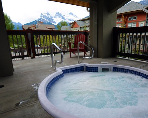 A balcony with hot tub.