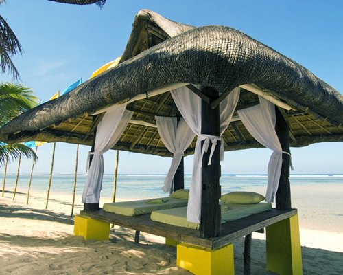 An outdoor spa area alongside the beach.