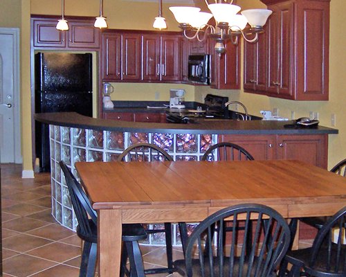 An open plan kitchen and dining area with a microwave.