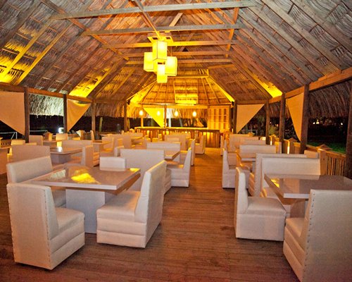 A well furnished indoor restaurant with an outside view.