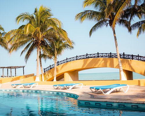 A balcony view of a large indoor fine dining area at the Reef Yucatan Hotel & Convention Center.
