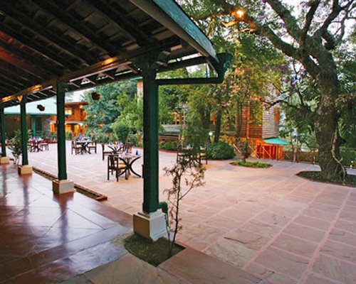 An outdoor fine dining area of the Mountain Club with the trees.
