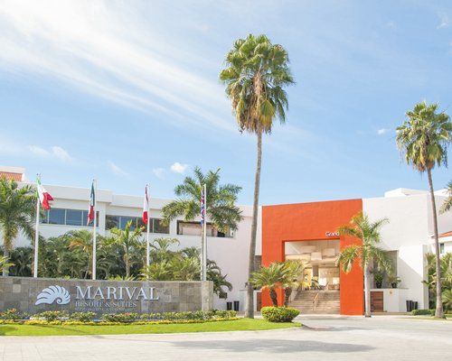 An exterior view of Marival Resort & Suites with a signboard.