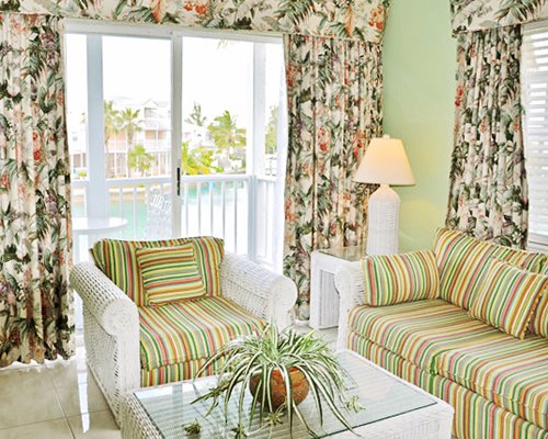 A well furnished living room with balcony.