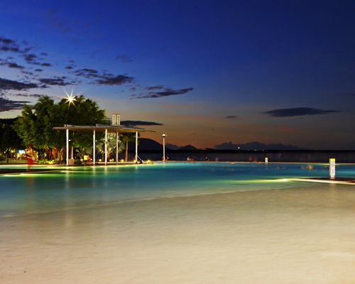 An outdoor pool at dusk.