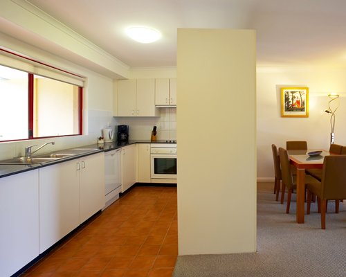 A well equipped kitchen alongside the dining area.