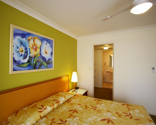 A well furnished bedroom with king bed.