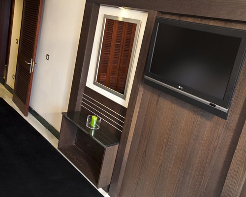 A wall mounted flat screen television.