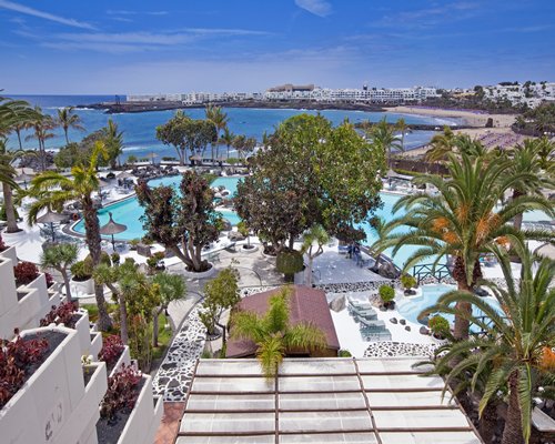 Scenic view of an outdoor swimming pool alongside the ocean.