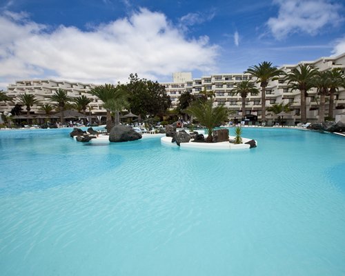 Scenic exterior view of Club Melia at Gran Melia Salinas with large outdoor swimming pool.