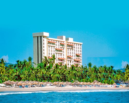 An exterior view of Holiday Inn Resort Ixtapa resort alongside the waterfront.
