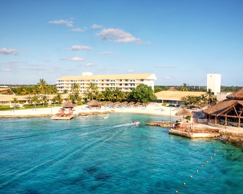 Exterior view of Presidente Intercontinental Cozumel resort from the waterfront.