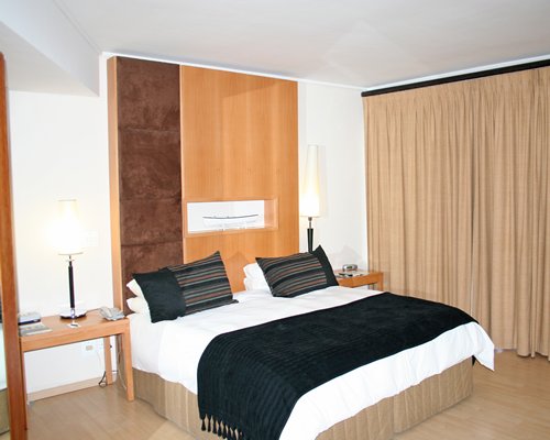 A well furnished bedroom with a king bed.