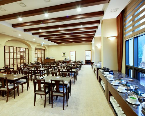 An indoor restaurant with a buffet.