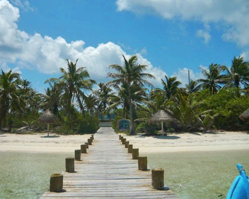 A wooden pathway leading to the resort.
