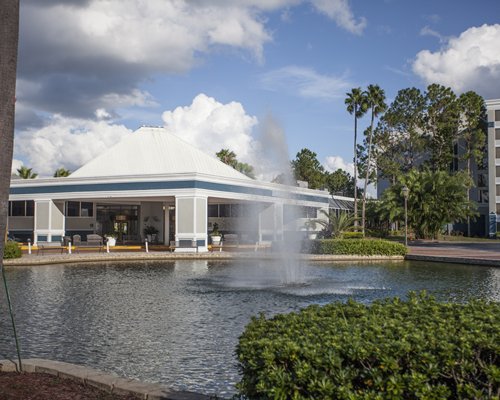 A fountain in the water alongside the resort.