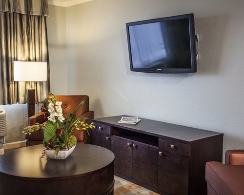 A well furnished living room with a television.